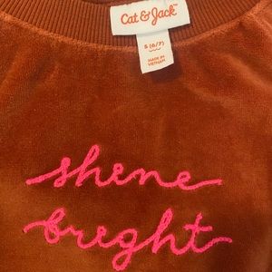 NWOT. Never worn. Girls size 6/7 small crew velour 2-piece Cat & Jack suit.